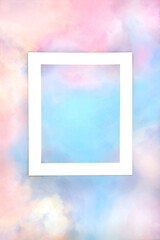Rainbow sky cloud background with white frame. Abstract colourful minimal pastel coloured border design. LGBT themed nature concept. 