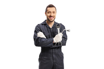 Car mechanic holding a wrench and a key tool