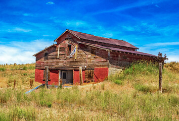 An old wooden barn abandoned on the Montana Landscape.