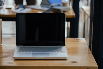 laptop on working desk in modern office. office workspace concept.