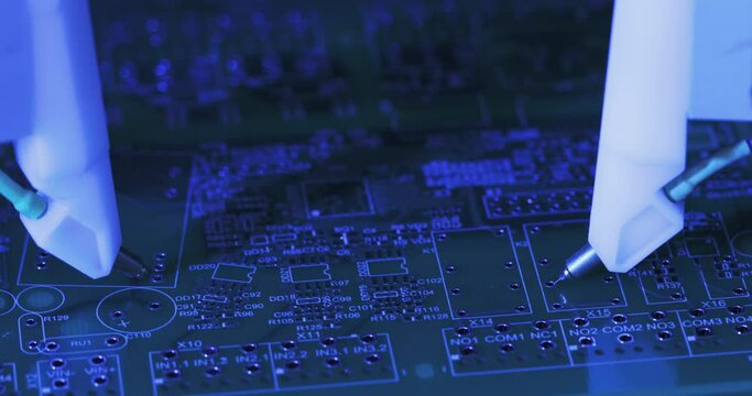 Close-up working moving needles on automatic equipment manufactoring of microchips. Process of production of microcircuits and circuit boards, micro soldering of chips. High-tech technologies.