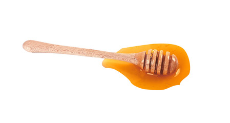 honey dripping from a wooden dipper