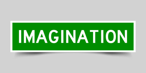 Sticker label with word imagination in green color on gray background