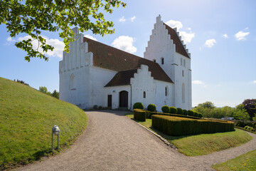Fototapeta na wymiar The famous Elmelunde Church is located in the village of Elmelunde, Møn