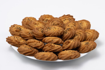 Cookies or biscuit stacked on plate for breakfast or snacks, a healthy concept lifestyle with copy space for text isolated on white background