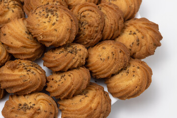 Closeup of Cookies or biscuit stacked on plate for breakfast or snacks, a healthy concept lifestyle with copy space for text isolated on white background
