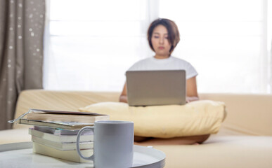 book and hot drink for author working at home