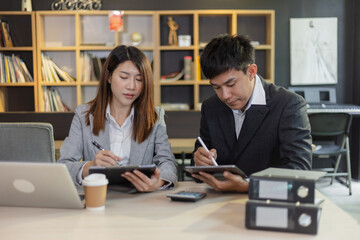Person analyzing figures, Two businessman working on tablet and new startup marketing idea presentation, Business meeting discussion startup concept.	