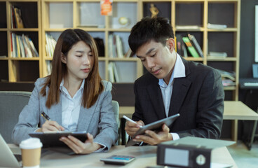 Technology and financial advisory services concert. Business teamwork and working on digital laptop computer with advisor showing plan of investment to clients at table office. Digital marketing.