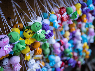 colorful of lucky charms for good weather displayed at a shinto shrine in tokyo, Japan