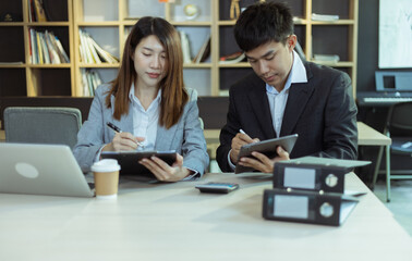 Technology and financial advisory services concert. Business teamwork and working on digital laptop computer with advisor showing plan of investment to clients at table office. Digital marketing.