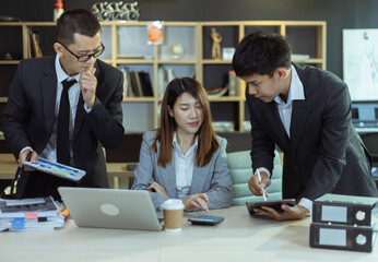 Technology and financial advisory services concert. Business teamwork and working on digital laptop computer with advisor showing plan of investment to clients at table office. Digital marketing.