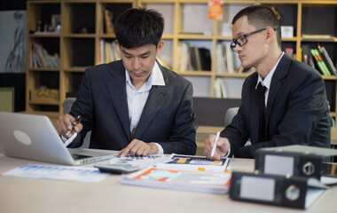 Technology and financial advisory services concert. Business teamwork and working on digital laptop computer with advisor showing plan of investment to clients at table office. Digital marketing.