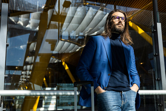 Thoughtful man waiting for flight in airport