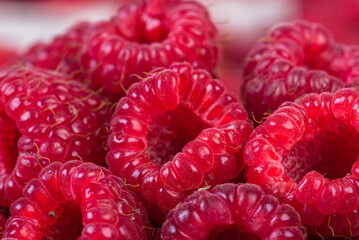 Ripe raspberries fruit, vegetarian healthy food close-up
