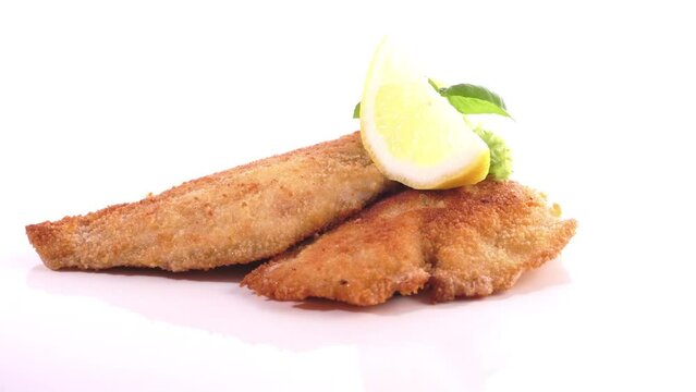 Fried Fish Fillet - Food on a turntable isolated on white background