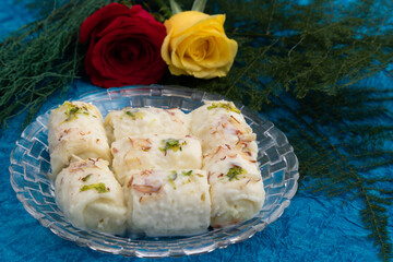 Indian Mithai Bread Malai Roll Rabdi Or Bengali Rabri Is Made Of Soft White Bread Slices, Dipped Soaked Or Dunked In Simmering Creamy Milk With Kesar, Khoya, Mawa, Mava, Khoa, Pista, Badam, Kaju