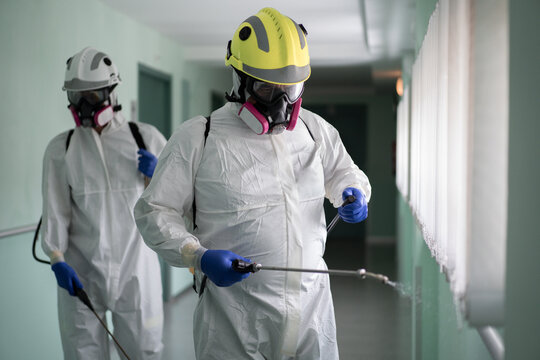 Firefighters disinfecting the interior of a building
