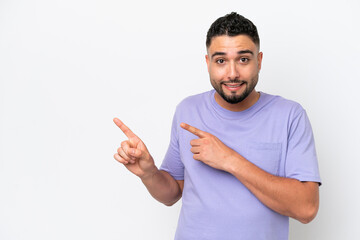 Young Arab handsome man isolated on white background frightened and pointing to the side