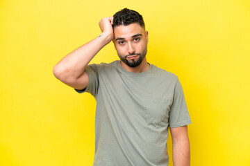 Fototapeta na wymiar Young Arab handsome man isolated on yellow background with an expression of frustration and not understanding
