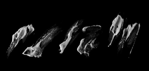 Set foam smeared, shaving cream bubble isolated on black background, with clipping path texture,...