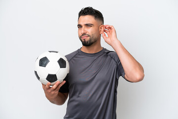 Arab young football player man isolated on white background having doubts