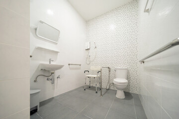 Public handicap toilet for disable people. Men bathroom doors in restroom in restaurant or hotel or shopping mall, empty interior decoration design