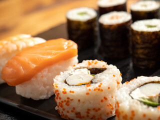 Japanese kitchen. Sushi on a dark background.