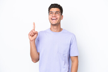 Young caucasian man isolated on white background pointing up and surprised