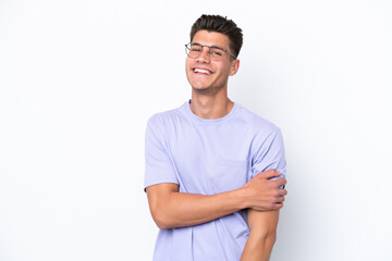 Fototapeta premium Young caucasian man isolated on white background laughing