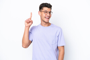 Fototapeta premium Young caucasian man isolated on white background intending to realizes the solution while lifting a finger up