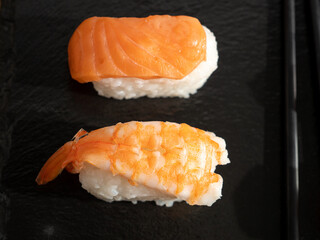 Japanese kitchen. Sushi on a dark background.
