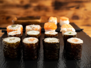Japanese kitchen. Sushi on a dark background.