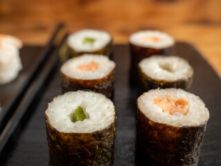 Japanese kitchen. Sushi on a dark background.