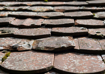 Roofing detail. It is arched and old, dirty and broken.