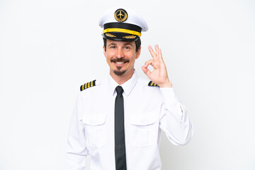 Airplane caucasian pilot isolated on white background showing ok sign with fingers