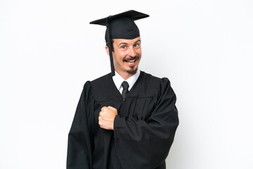 Young university graduate man isolated on white background celebrating a victory