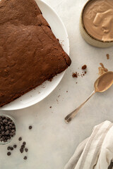 Chocolate one pan sponge cake, moist and rich homemade cake, bright table, top view. Making cake process.
