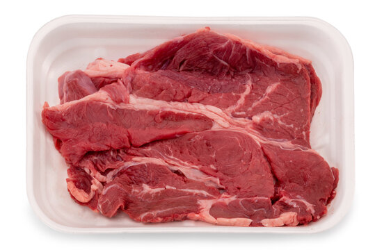 Raw beef steak in styrofoam food tray isolated on white, clipping path
