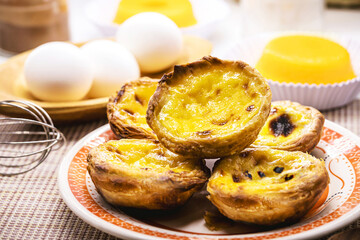 Pastel de nata, called Pastel de Belem, traditional Portuguese crunchy and sour sweet made with eggs, cinnamon or caramel