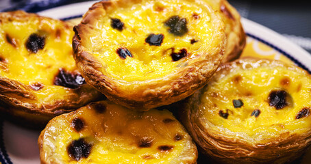 Portuguese Pastel de Nata, called Pastel de Belem, traditional Portuguese delicacy made with eggs, cinnamon and caramel