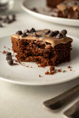 Chocolate sponge cake with cream. Homemade one pan chocolate cake. Bright table, top view. Making cake process.