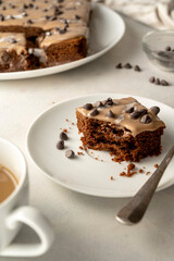 Chocolate sponge cake with cream. Homemade one pan chocolate cake. Bright table, top view. Making cake process.