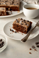 Chocolate sponge cake with cream. Homemade one pan chocolate cake. Bright table, top view. Making cake process.