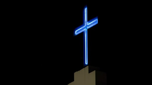Lighted Cross on Top of Caacupe Church in the Villa 21-24 Slum, where archbishop Jorge Mario Bergoglio, now Pope Francis, used to perform Charity Work, Buenos Aires, Argentina.  