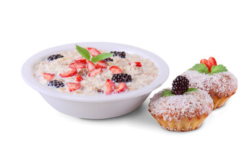 oatmeal with milk, berries and muffins on white background