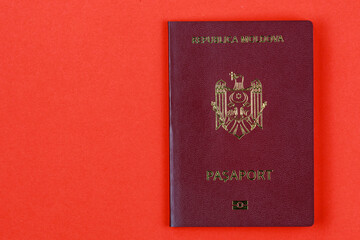 Modern foreign passport of a citizen of the Republic of Moldova. Background with copy space on the left