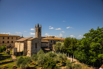 A church in the small hilltop walled medieval village of Monteriggioni in Tuscany, Italy, Europe.