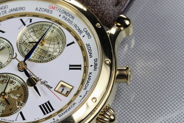 close up shallow focus Time zone cities code on luxury world time watch bezel on Bangkok time.