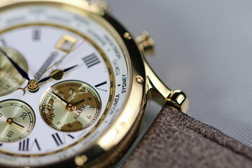 close up shallow focus Time zone cities code on luxury world time watch bezel on Sydney, Neumea, Tokyo.